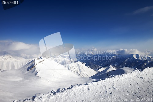 Image of Snowy mountains and off-piste slope at nice day