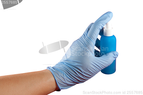 Image of Hand with glove pressing spray can
