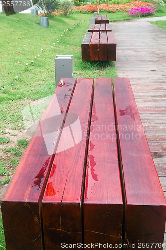 Image of Benches by wooden road