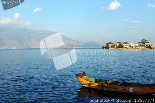 Image of Boat, village and lake