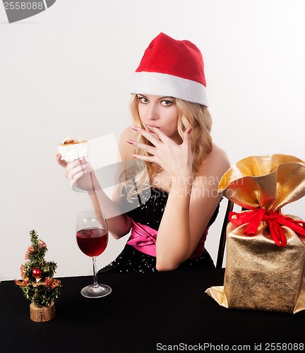 Image of Blond woman eating cake