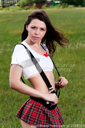 Image of Beautiful girl in mini-skirt outdoors