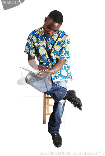 Image of Black man reading.