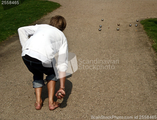 Image of Boy playing petanque