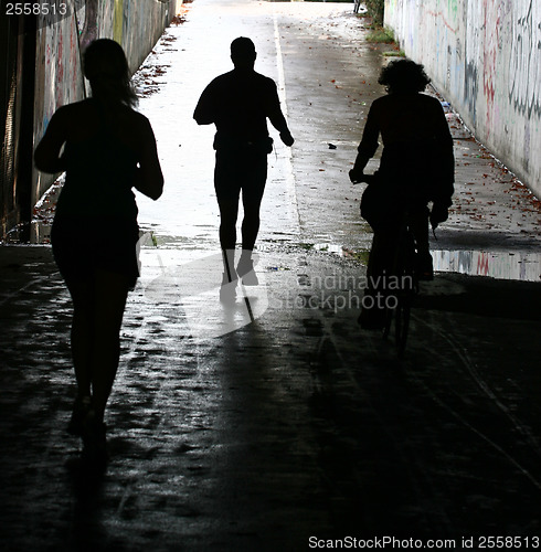 Image of People jogging in a city