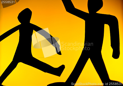 Image of People silhouette playing volleyball