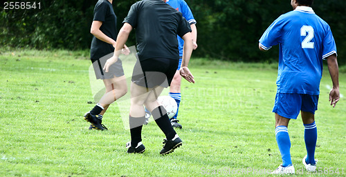 Image of Football player in blue without head