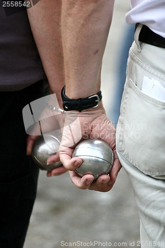 Image of Petanque players arms