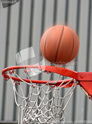 Image of Basket ball a second before falling in the net