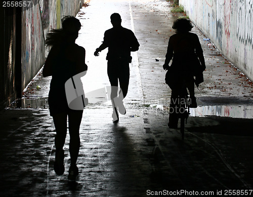 Image of People jogging in a city