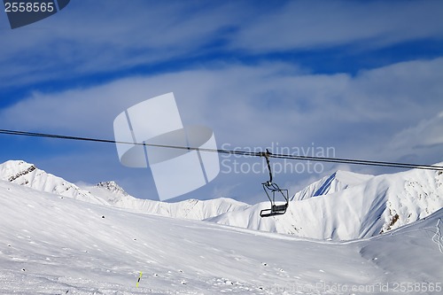 Image of Chair lift and off-piste slope at nice day