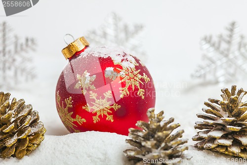 Image of Christmas ball with red bow and ribbon