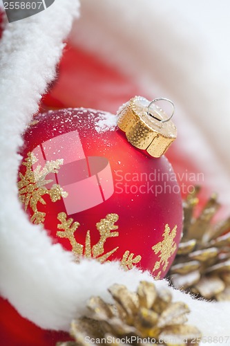 Image of Christmas ball with red bow and ribbon