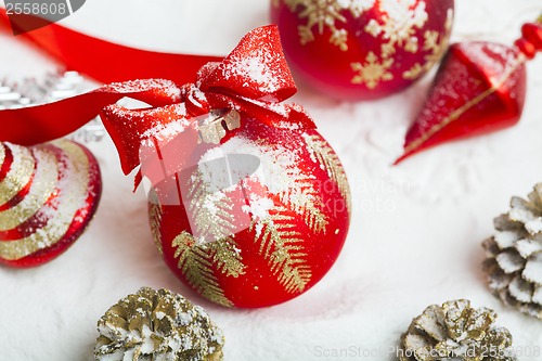 Image of Christmas ball with red bow and ribbon