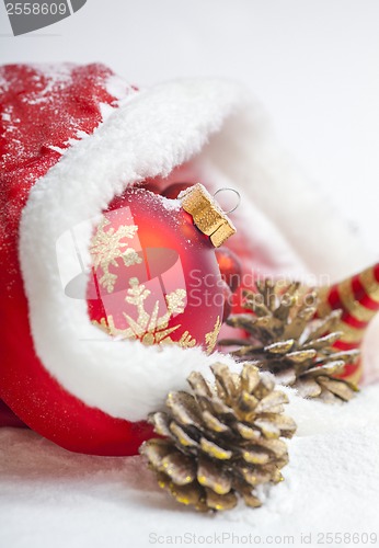 Image of Christmas ball with red bow and ribbon