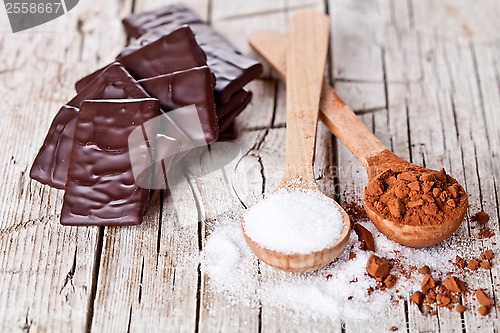 Image of chocolate sweets, cocoa powder and sugar