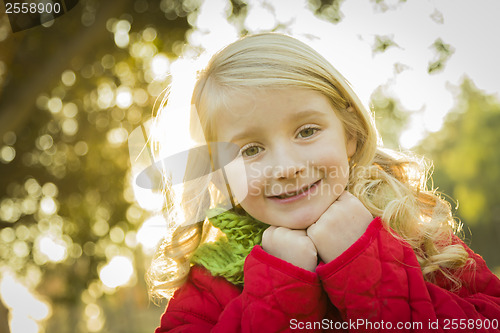 Image of Little Girl Wearing Winter Coat and Scarf at the Park
