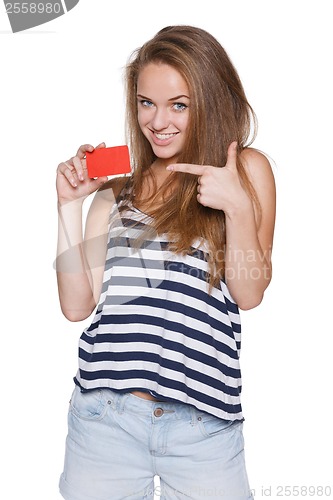 Image of Excited girl teenager hipster pointing to the blank credit card