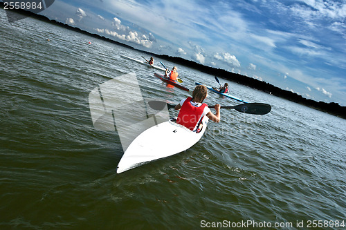 Image of Young people on kayak in denmark on a lake