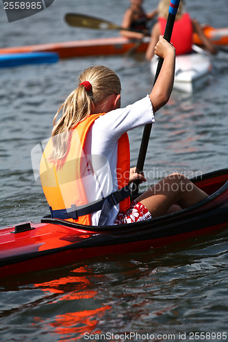 Image of Young people on kayak in denmark on a lake