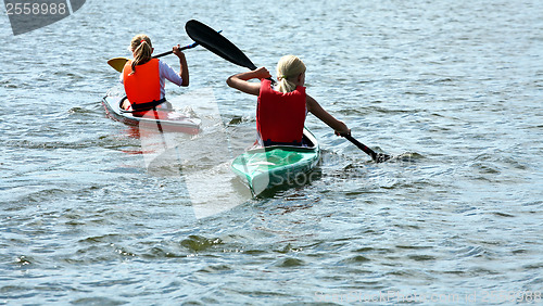 Image of Young people on kayak in denmark on a lake