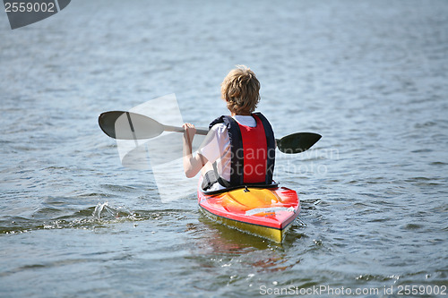 Image of Young people on kayak in denmark on a lake