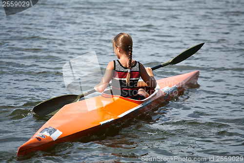 Image of Young people on kayak in denmark on a lake