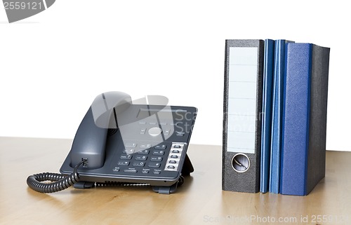 Image of modern business phone with ring binder