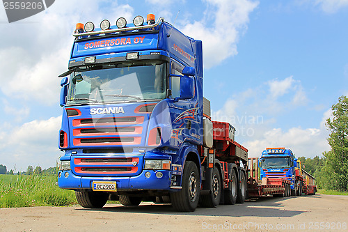 Image of Two Scania V8 Trucks with Drop Deck Trailer