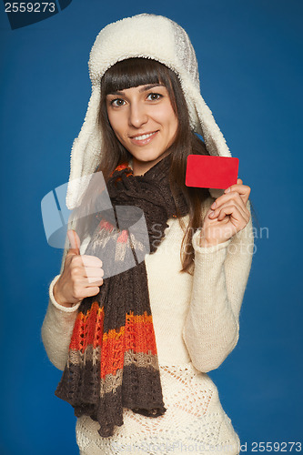 Image of Winter woman holding credit card
