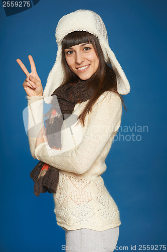 Image of Winter girl showing victory sign