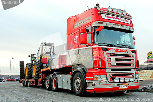 Image of Scania Truck Hauling a Forest Harvester 