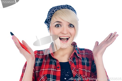 Image of Surprised woman with paintbrush