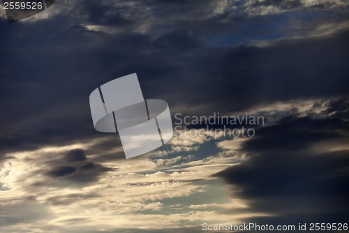Image of Dark sunset sky with clouds