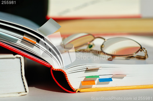 Image of Opened book and glasses