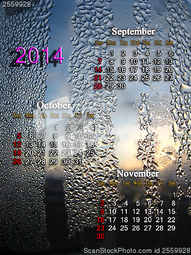 Image of calendar for autumn of 2014 year with water drops