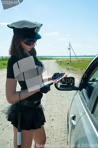 Image of Sexy police woman on road