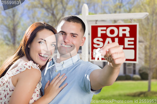 Image of Military Couple In Front of Home, House Keys and Sign