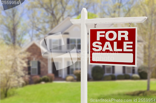 Image of Home For Sale Sign in Front of New House