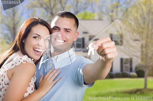 Image of Military Couple with House Keys In Front of New Home