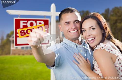 Image of Military Couple In Front of Home, House Keys and Sign