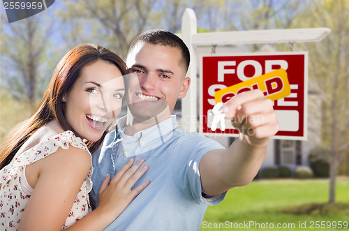 Image of Military Couple In Front of Home, House Keys and Sign