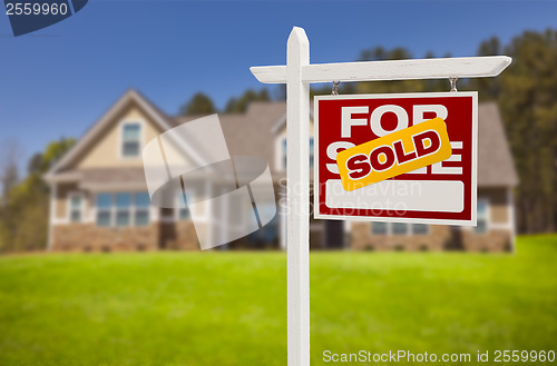 Image of Sold Home For Sale Sign in Front of New House