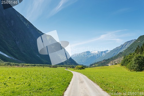 Image of Dirt road passing in a valley