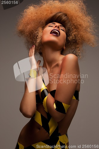 Image of woman with long curly hair