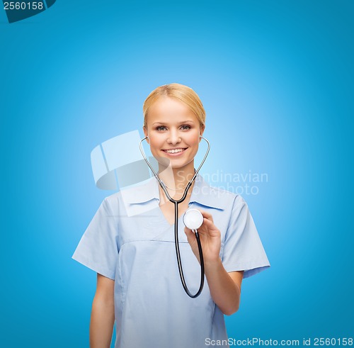 Image of smiling female doctor or nurse with stethoscope