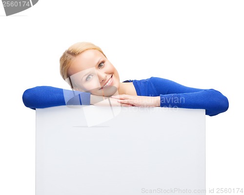 Image of woman in casual clothes with blank white board