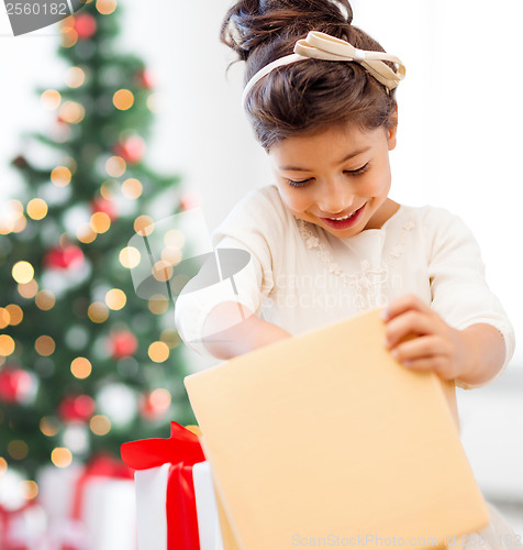 Image of happy child girl with gift box