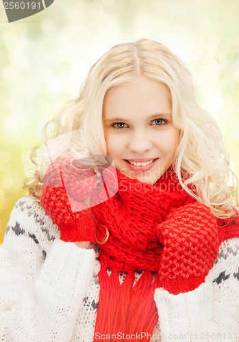 Image of teenage girl in red mittens and scarf