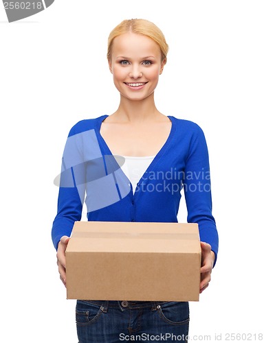 Image of smiling woman in casual clothes with parcel box